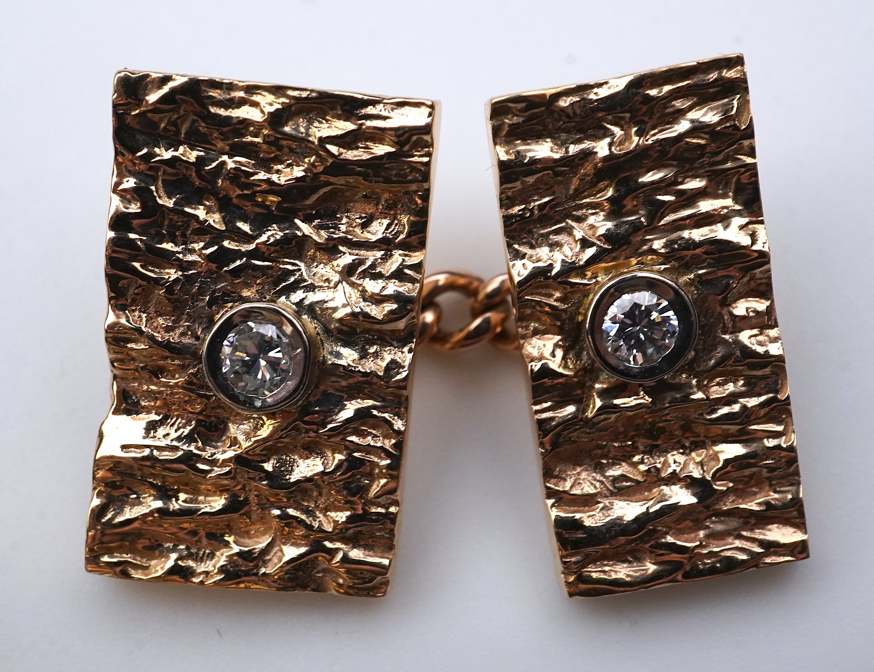 A pair of 9ct gold and diamond cufflinks, 1970s